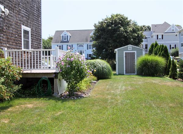 10 Cliff Estates Road, Unit 10 Scituate, MA 02066 - Photo 19 of 26 a view of a house with a garden and plants