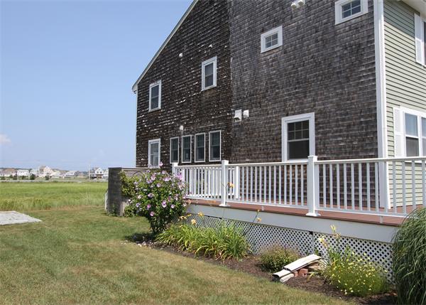 10 Cliff Estates Road, Unit 10 Scituate, MA 02066 - Photo 20 of 26 a front view of a house with a yard