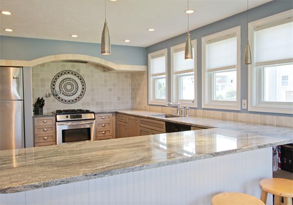 10 Cliff Estates Road, Unit 10 Scituate, MA 02066 - Photo 3 of 26 a view of a kitchen with a sink and a large window