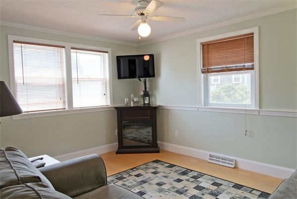 10 Cliff Estates Road, Unit 10 Scituate, MA 02066 - Photo 8 of 26 a living room with a bed furniture and a window