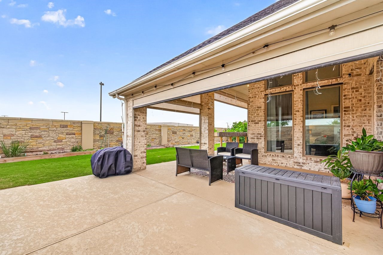 29730 Smoky Ridge Road Fulshear, TX 77441 - Photo 24 of 29 The patio extends and wraps around