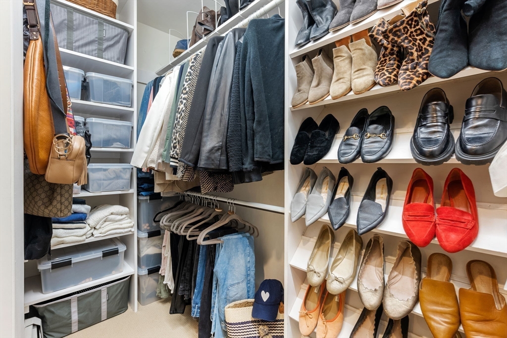 21 Gail Road Weston, MA 02493 - Photo 22 of 37 a view of walk in closet with clothes and shoes