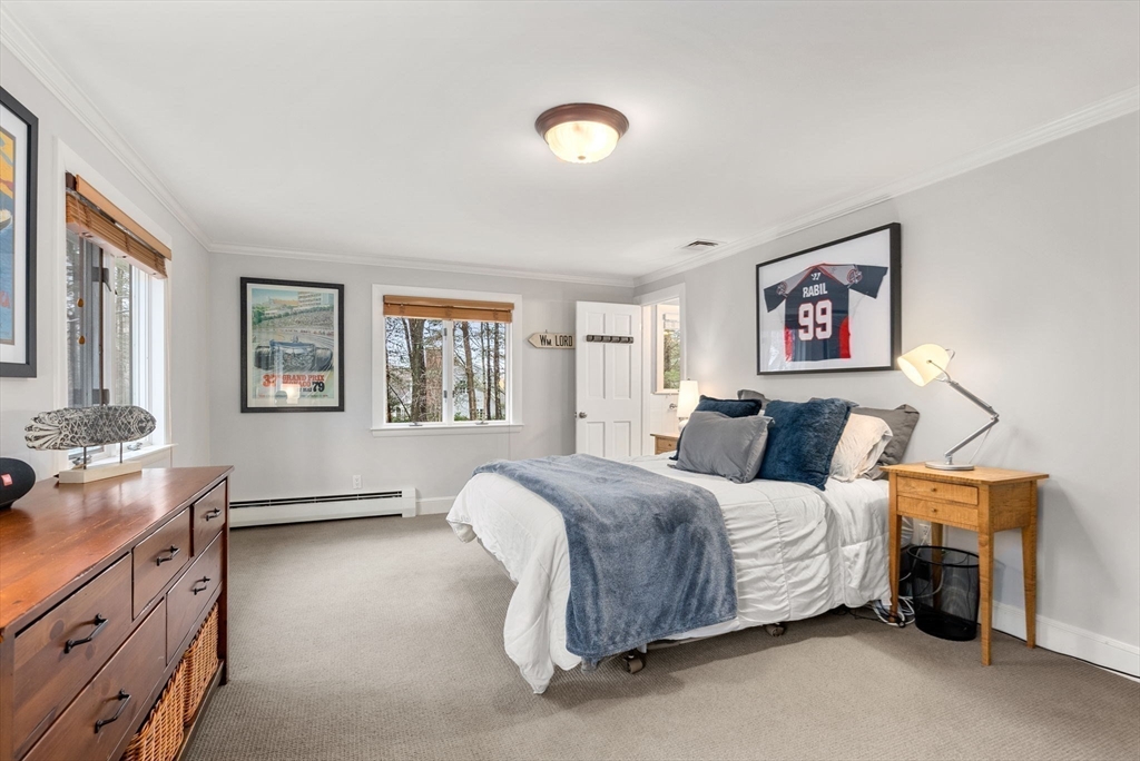 21 Gail Road Weston, MA 02493 - Photo 25 of 37 a spacious bedroom with a bed and a dresser