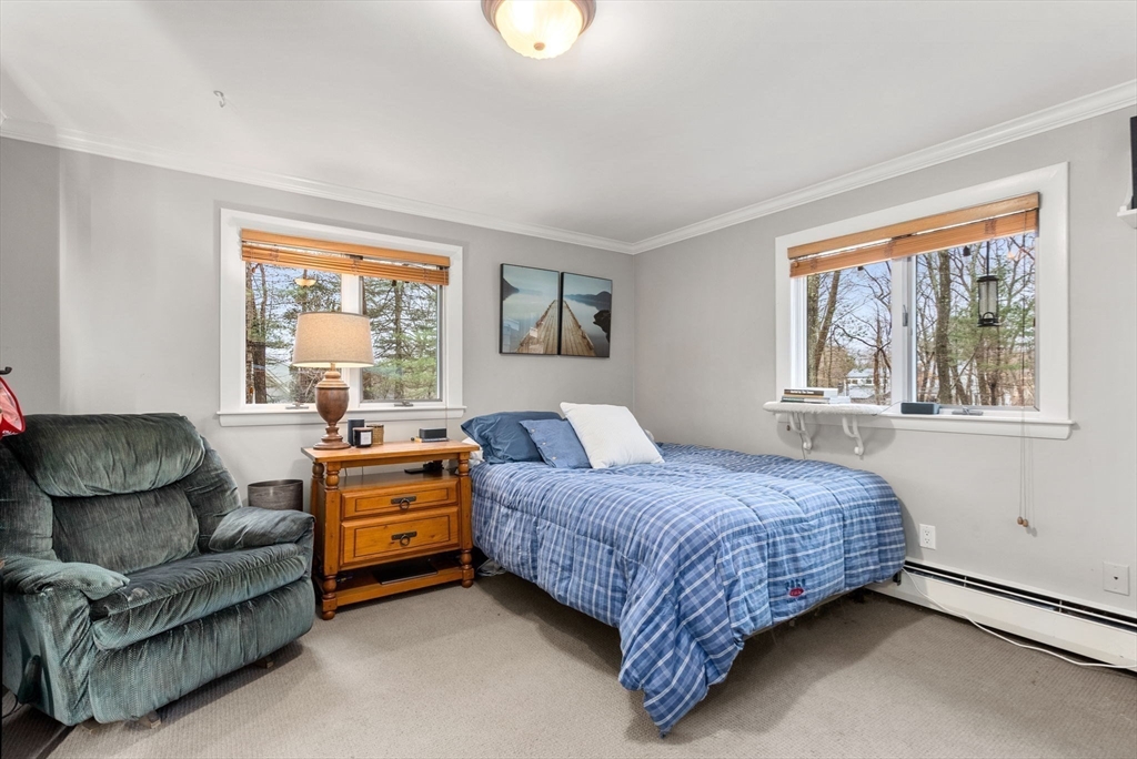 21 Gail Road Weston, MA 02493 - Photo 28 of 37 a bedroom with a bed couch and window