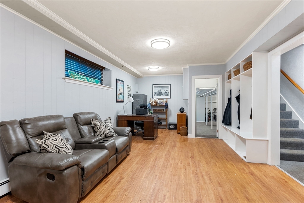 21 Gail Road Weston, MA 02493 - Photo 31 of 37 a living room with furniture and a wooden floor