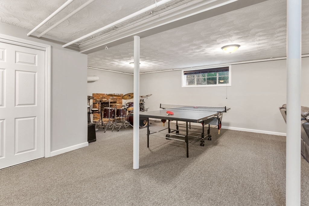 21 Gail Road Weston, MA 02493 - Photo 33 of 37 a view of a livingroom with furniture and a table