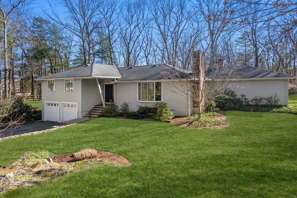 21 Gail Road Weston, MA 02493 - Photo 37 of 37 a view of a house with backyard sitting area and garden