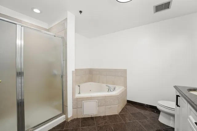 a bathroom with a bathtub and a toilet