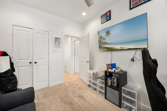 a view of a livingroom with furniture and toys