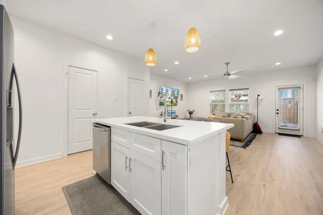 a kitchen with a sink and a refrigerator