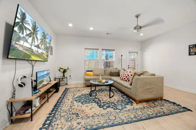 a living room with furniture and a rug
