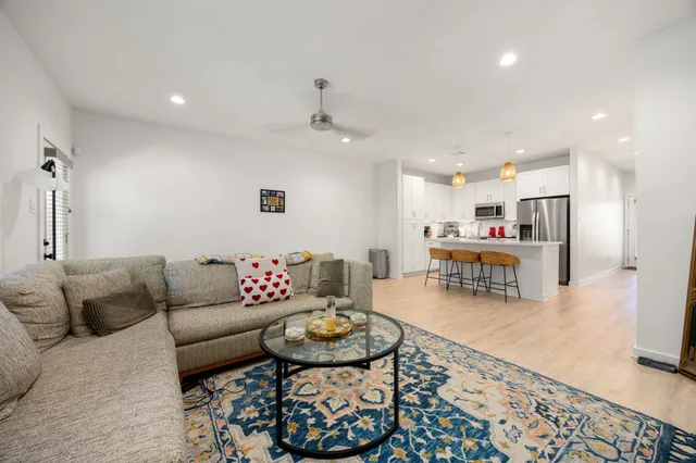 a living room with furniture and a table