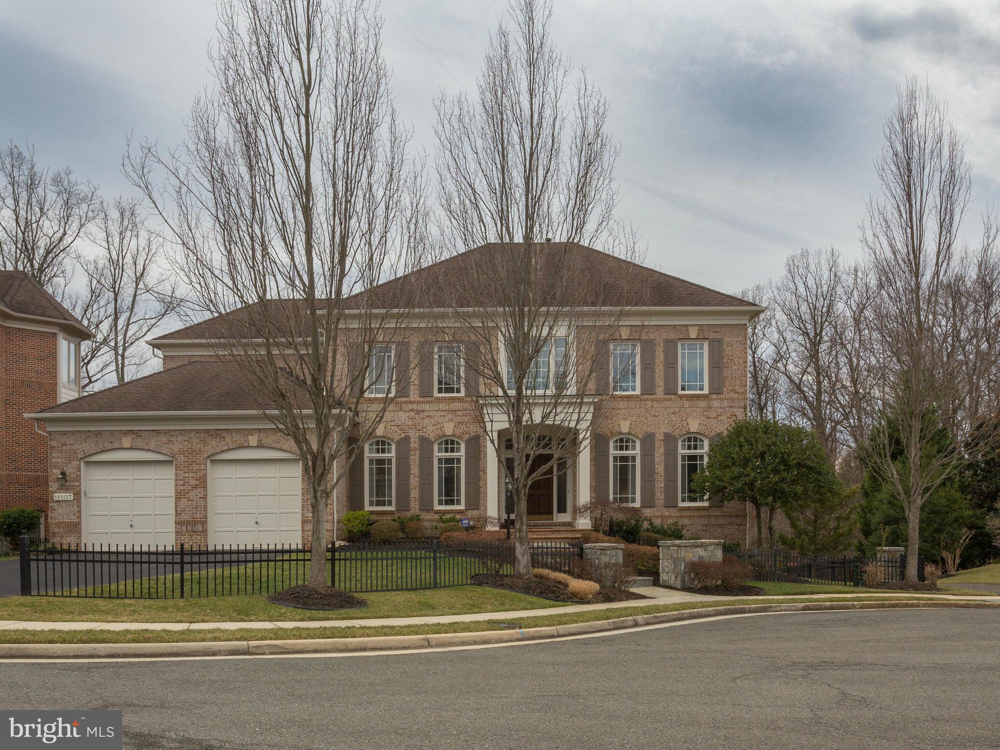 11107 Chessington Place Reston, VA 20194 - Photo 2 of 30 a house that has a lots of windows in it