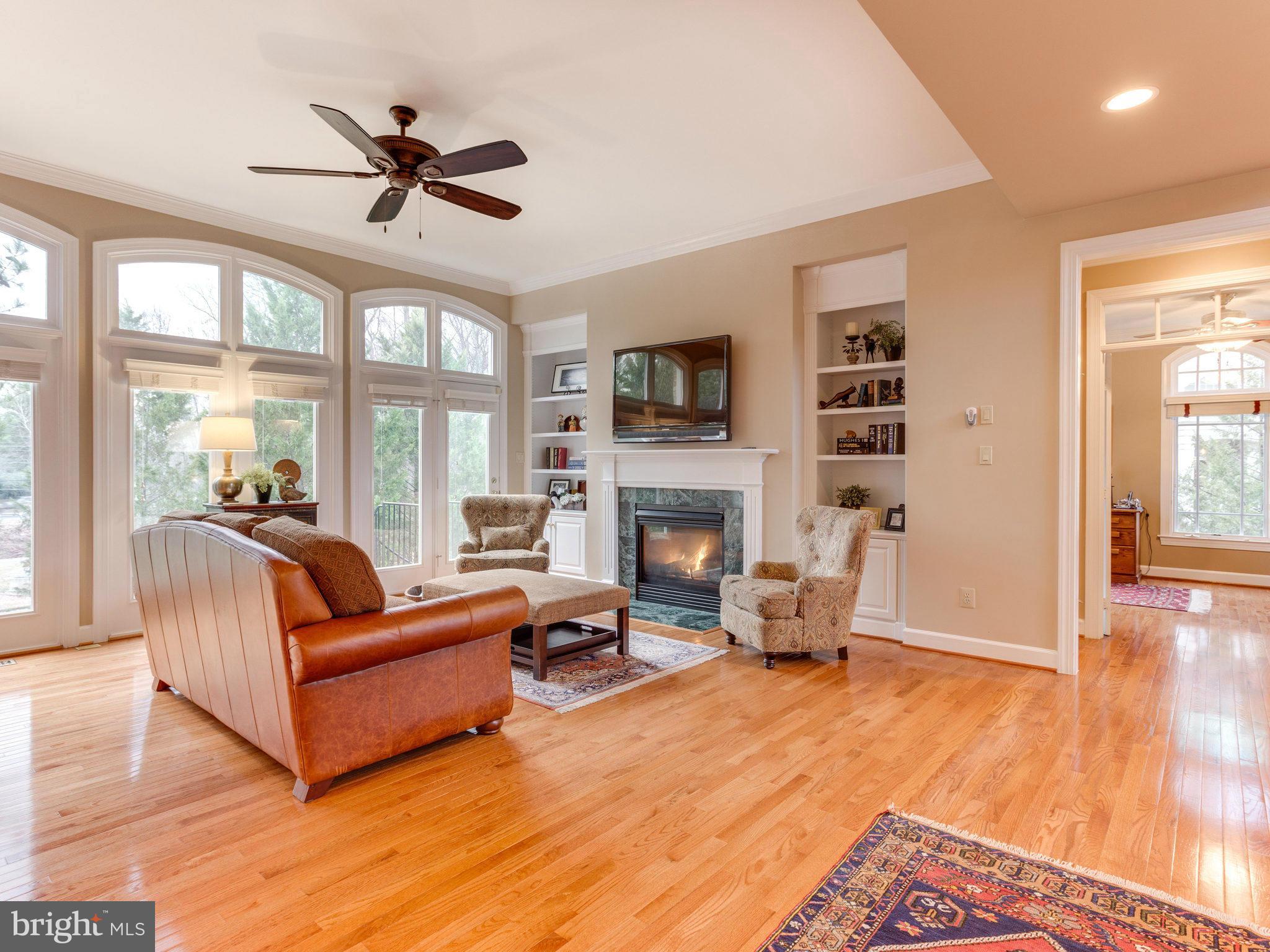 11107 Chessington Place Reston, VA 20194 - Photo 11 of 30 a living room with furniture and a fireplace