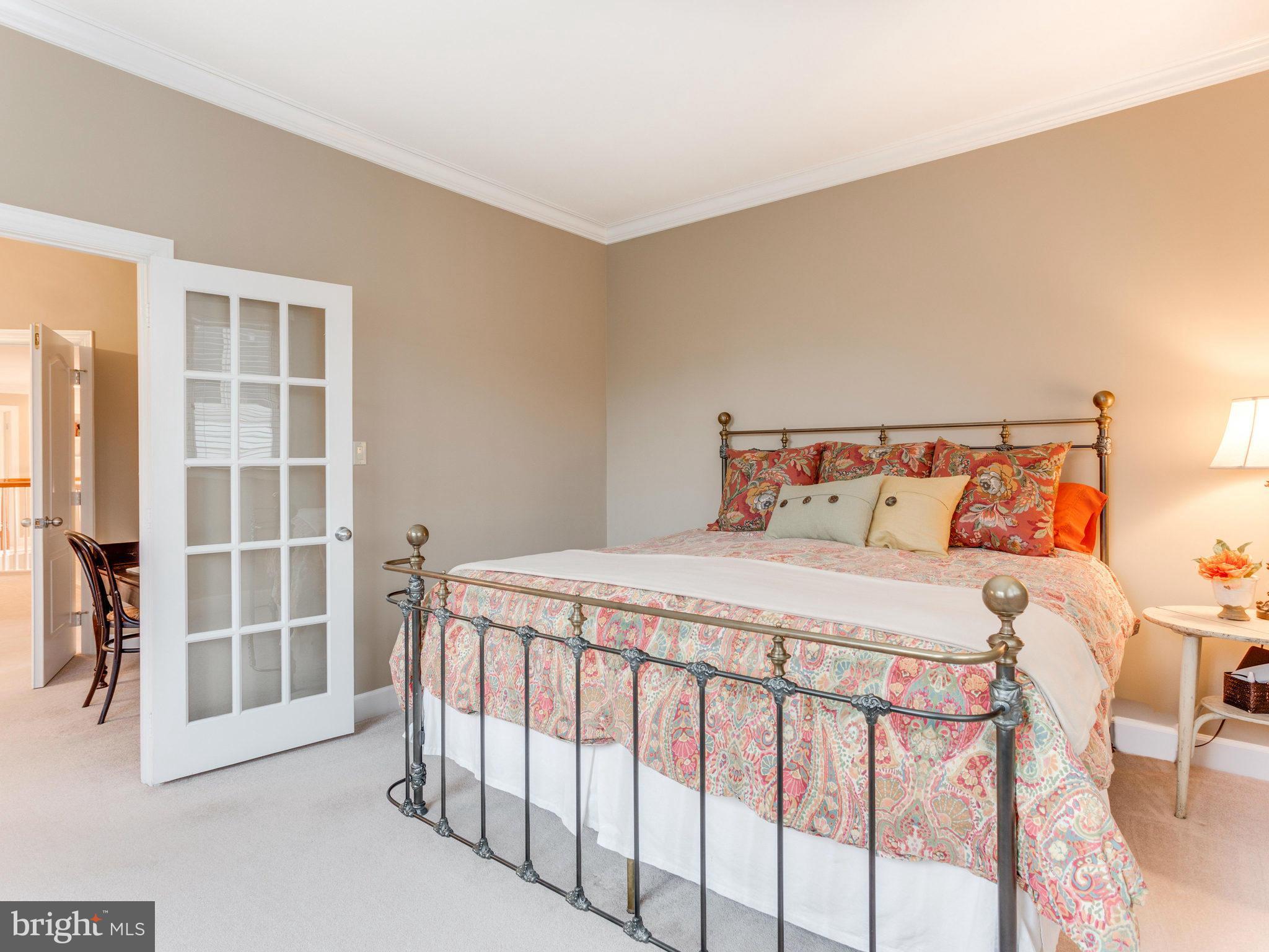 11107 Chessington Place Reston, VA 20194 - Photo 17 of 30 a bedroom with a bed and a window