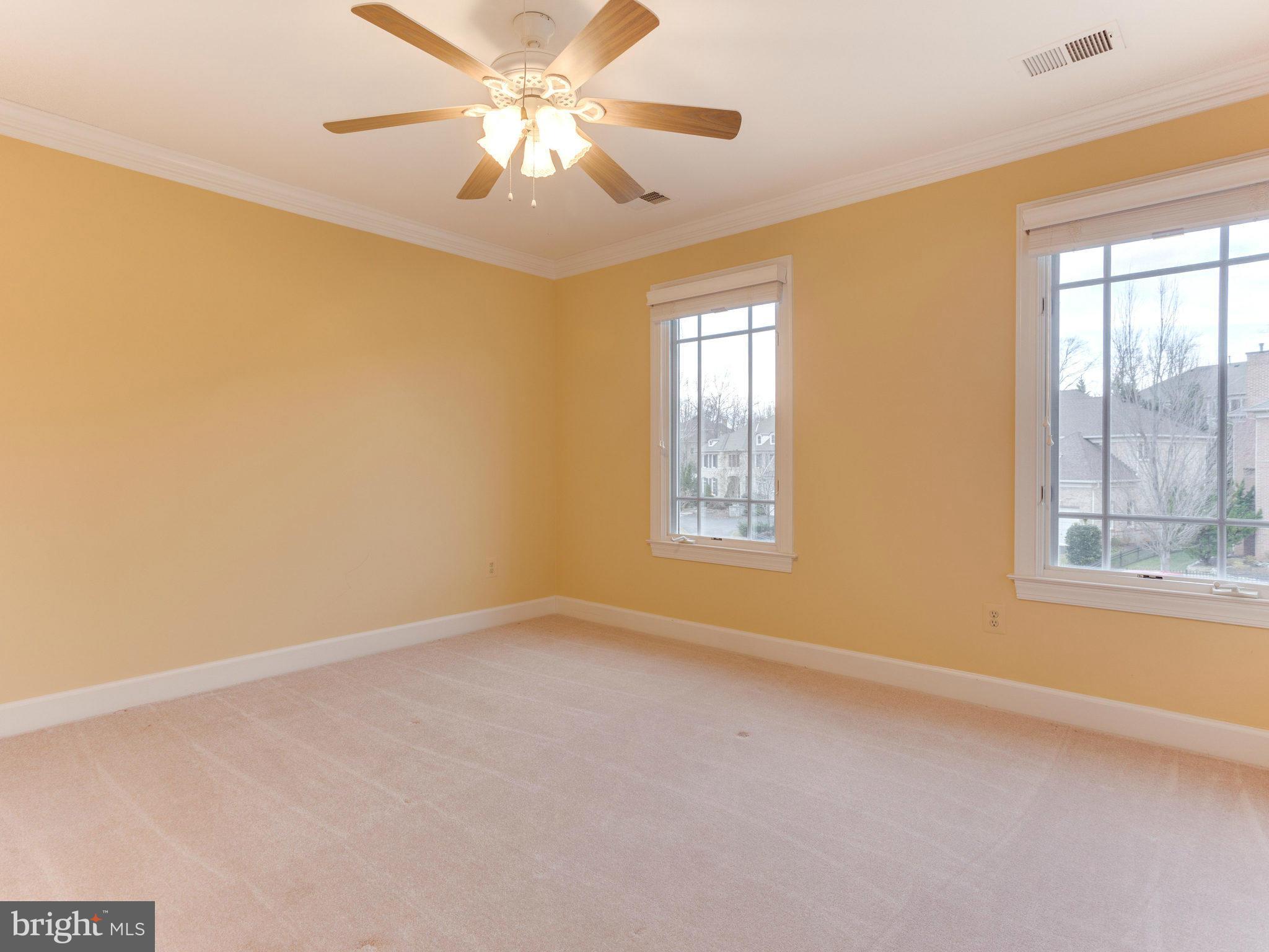 11107 Chessington Place Reston, VA 20194 - Photo 23 of 30 an empty room with windows and fan