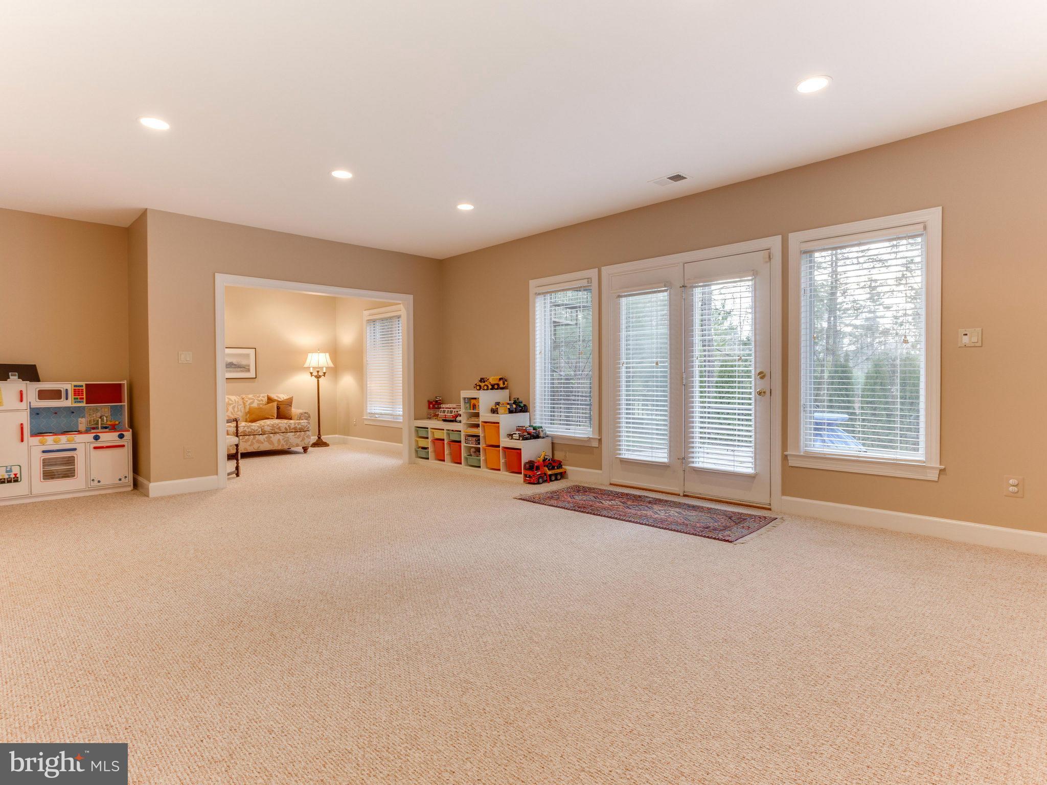 11107 Chessington Place Reston, VA 20194 - Photo 26 of 30 a view of a room with gym equipment and a large window