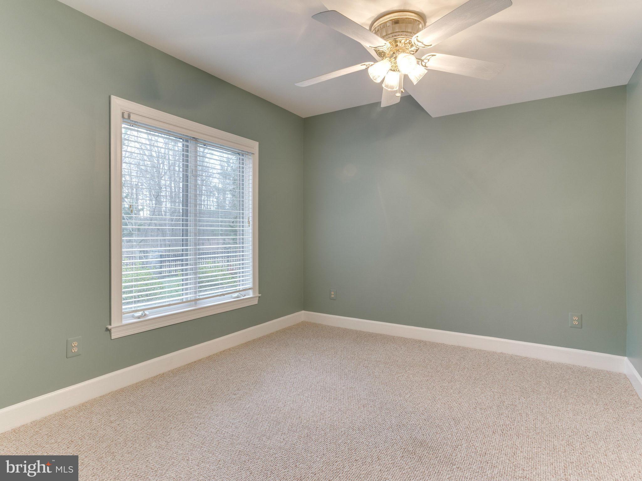 11107 Chessington Place Reston, VA 20194 - Photo 27 of 30 an empty room with a window and a fan