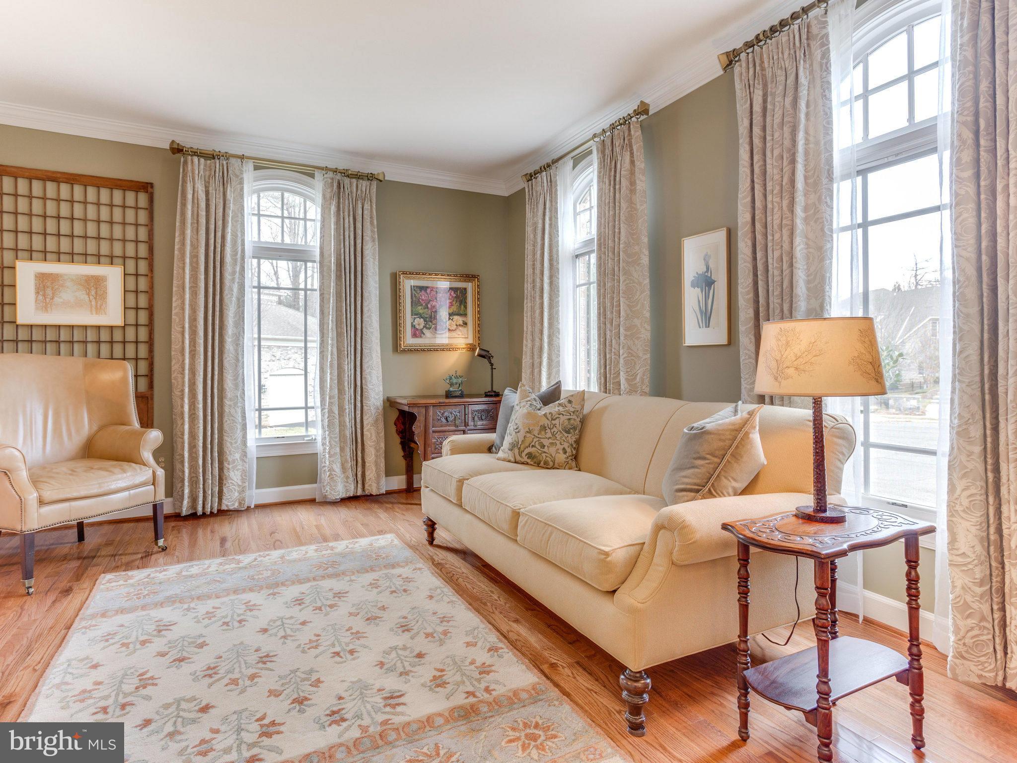 11107 Chessington Place Reston, VA 20194 - Photo 7 of 30 a living room with furniture and a large window