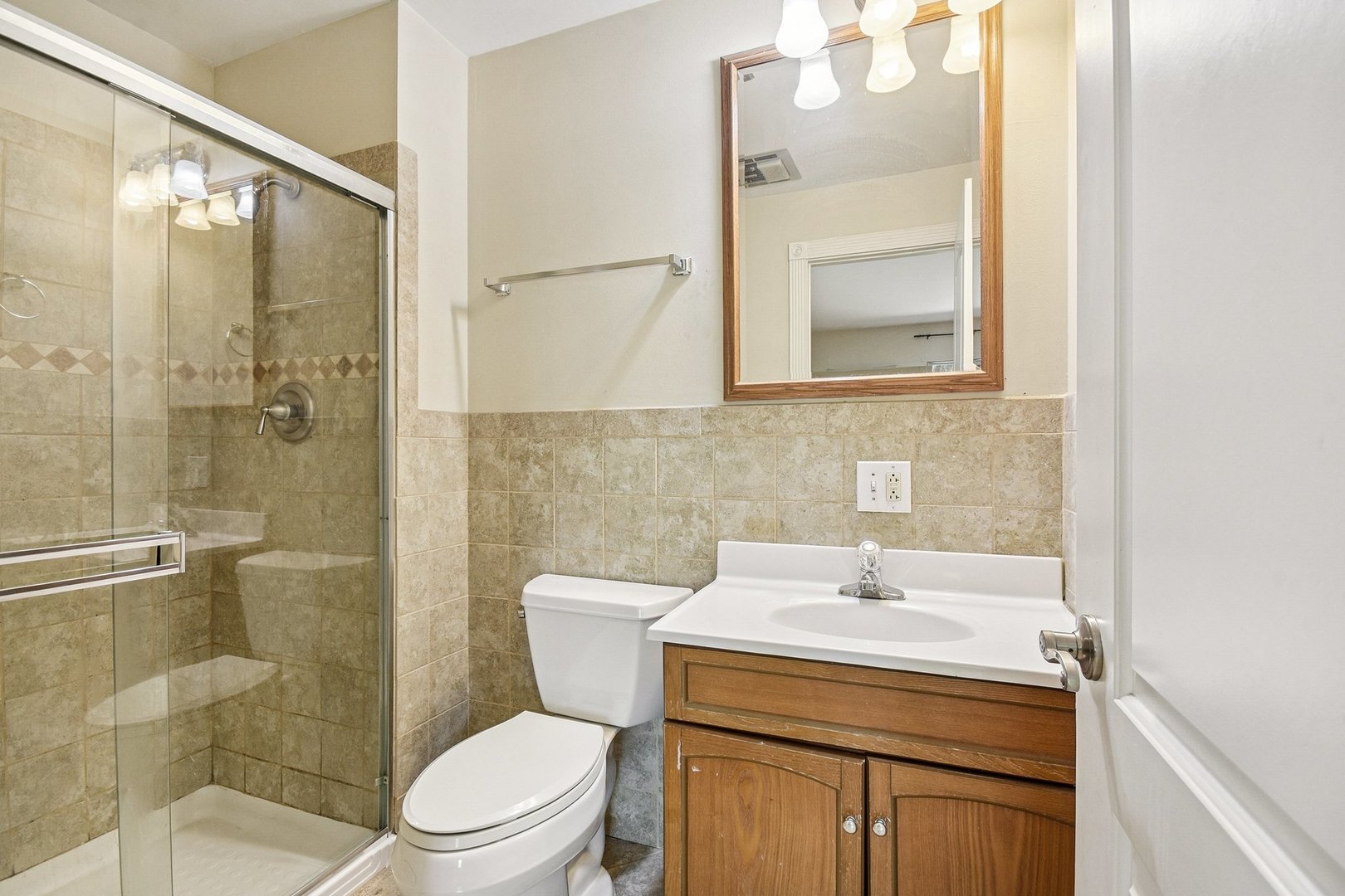 461 North Jonathan Drive, Unit 202 Palatine, IL 60074 - Photo 21 of 23 a bathroom with a sink a toilet and shower