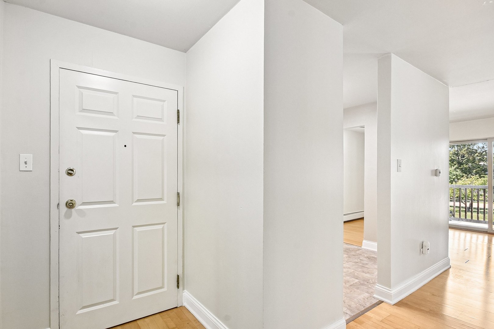 461 North Jonathan Drive, Unit 202 Palatine, IL 60074 - Photo 5 of 23 a view of a hallway with wooden floor