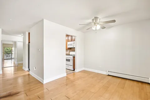 an empty room with closet and windows