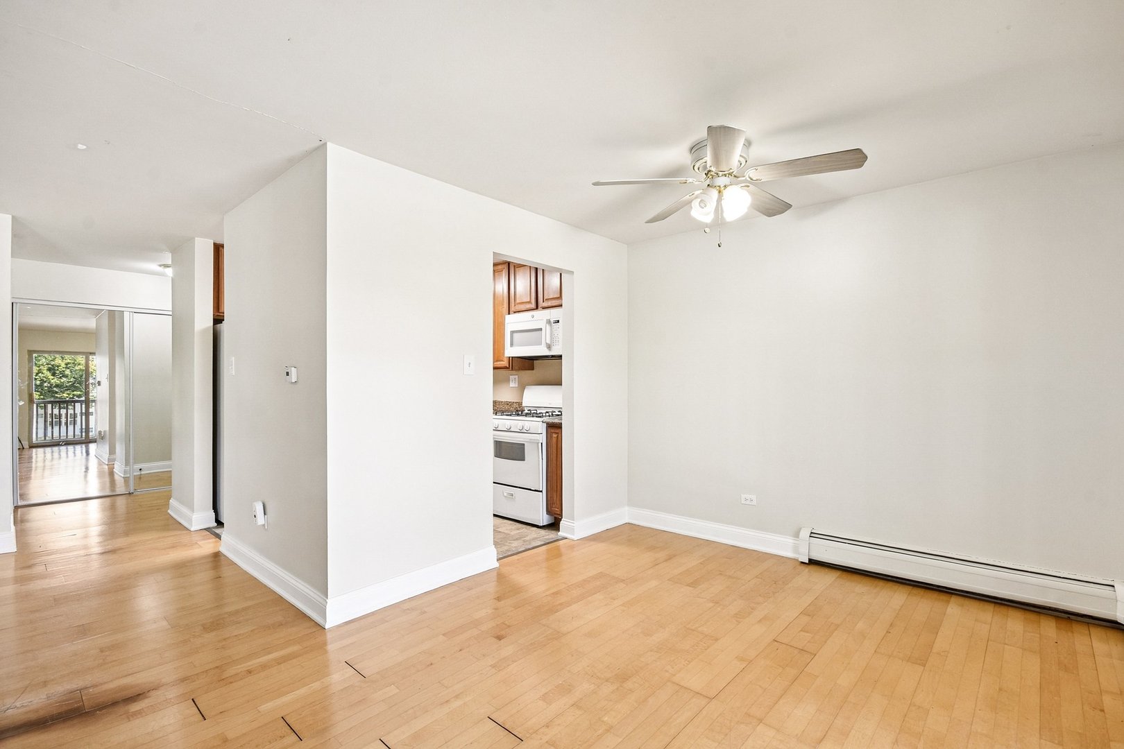461 North Jonathan Drive, Unit 202 Palatine, IL 60074 - Photo 9 of 23 an empty room with closet and windows