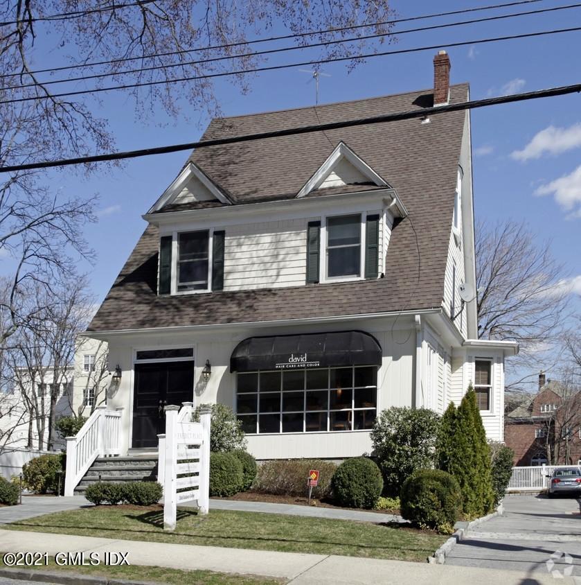 23 Benedict Place, Unit 3 Greenwich, CT 06830 - Photo 1 of 16 a front view of a house with a yard