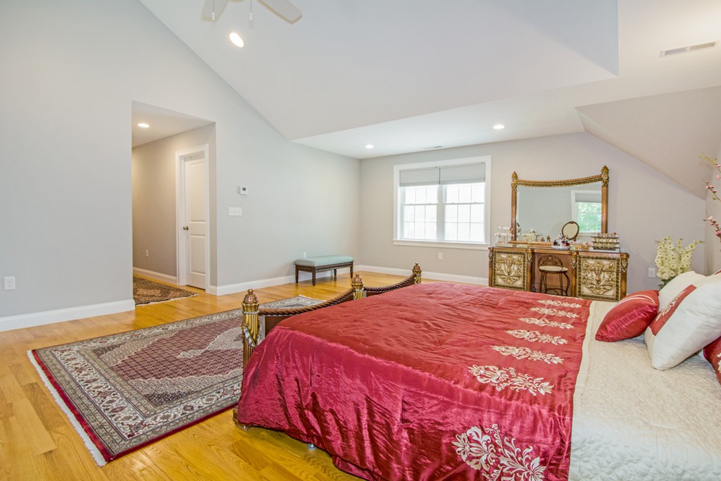 127 Lowell Street Lexington, MA 02420 - Photo 13 of 30 a bedroom with a bed and dresser