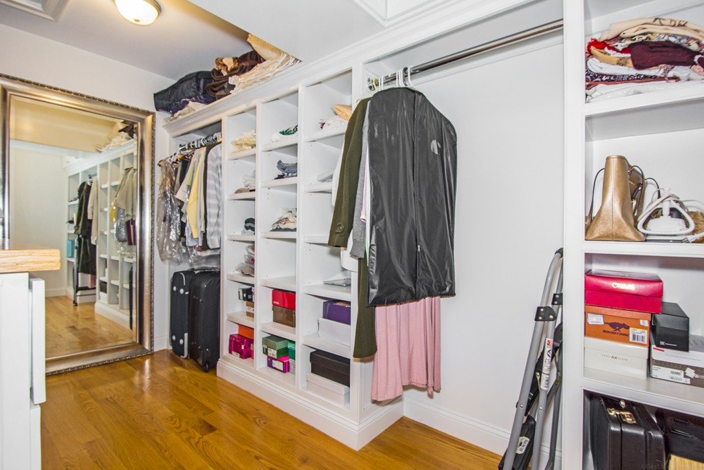 127 Lowell Street Lexington, MA 02420 - Photo 16 of 30 a view of walk in closet with clothes and shoes