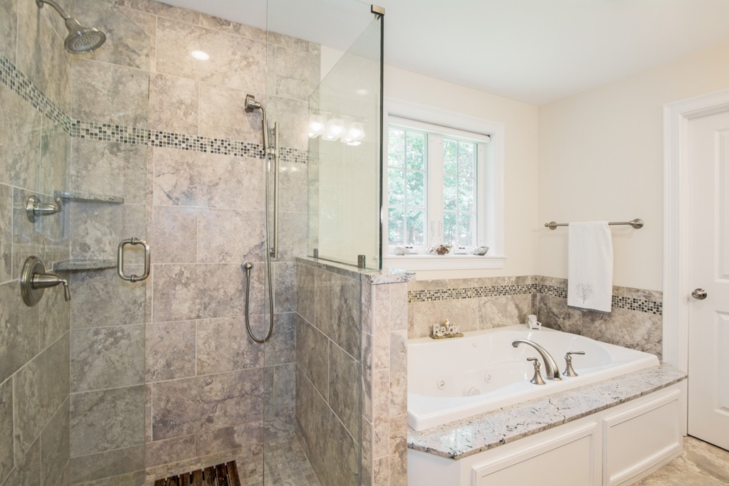 127 Lowell Street Lexington, MA 02420 - Photo 17 of 30 a bathroom with a tub a sink and a shower