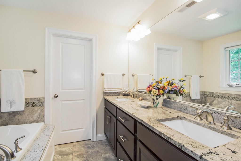 127 Lowell Street Lexington, MA 02420 - Photo 18 of 30 a bathroom with a granite countertop double vanity sink and a mirror