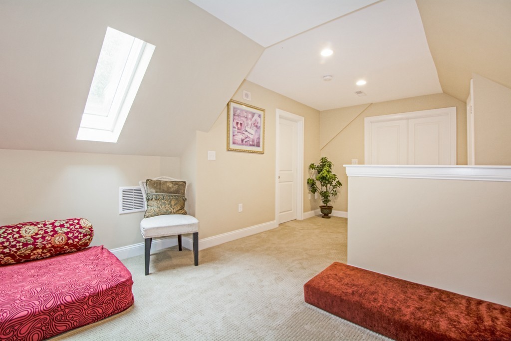 127 Lowell Street Lexington, MA 02420 - Photo 22 of 30 a bedroom with furniture and a bed