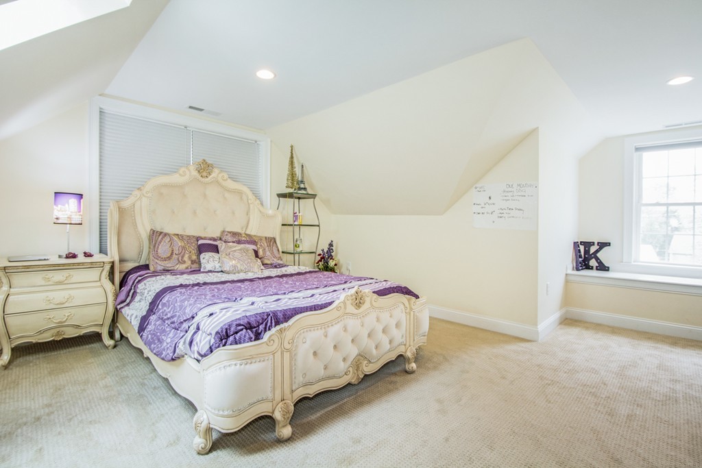 127 Lowell Street Lexington, MA 02420 - Photo 23 of 30 a bedroom with a bed and a window