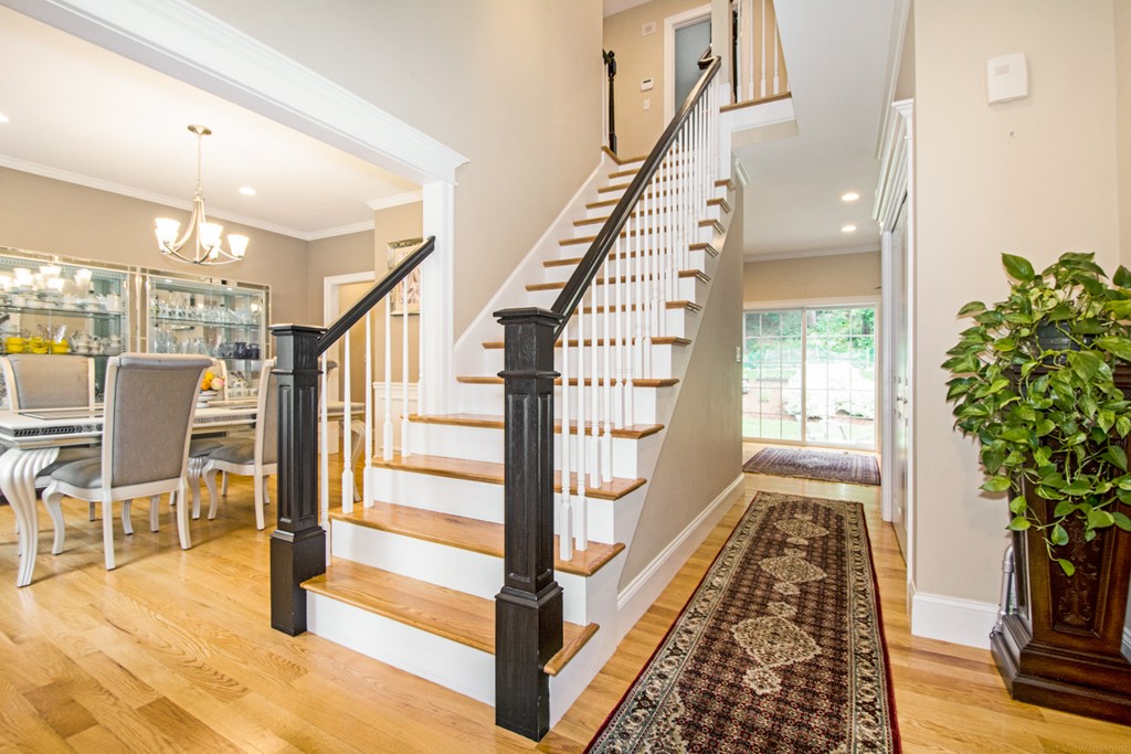 127 Lowell Street Lexington, MA 02420 - Photo 3 of 30 a view of entryway and hall with wooden floor
