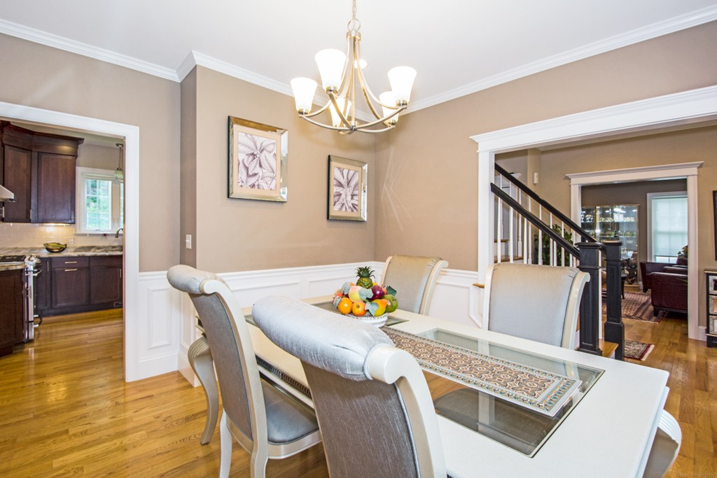 127 Lowell Street Lexington, MA 02420 - Photo 5 of 30 a view of a dining room with furniture and a chandelier