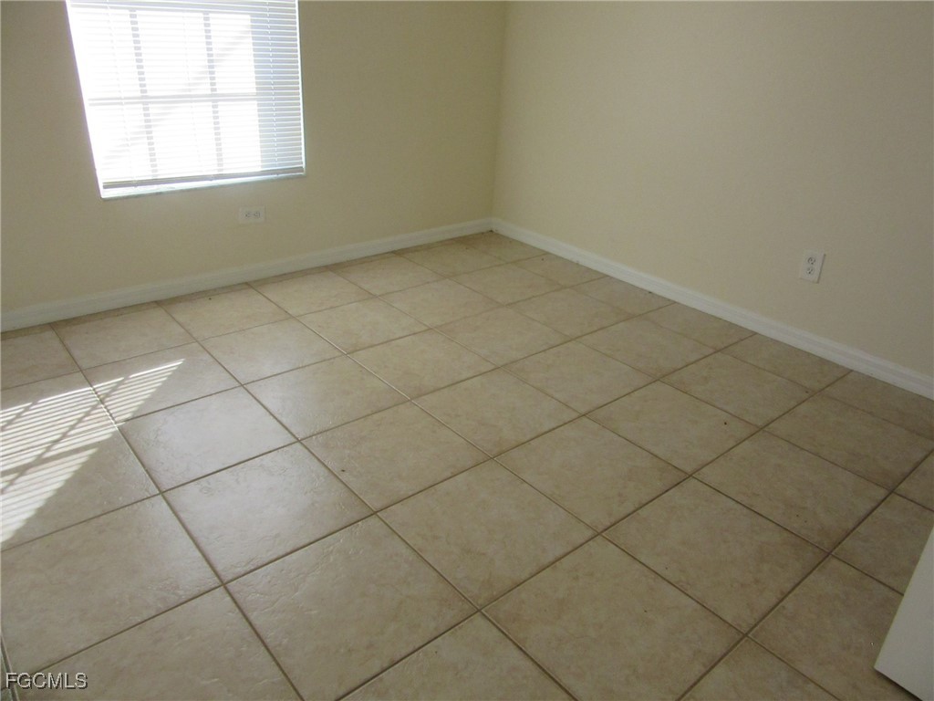 4544-4546 28th Street Southwest Lehigh Acres, FL 33973 - Photo 7 of 23 an empty room and a window