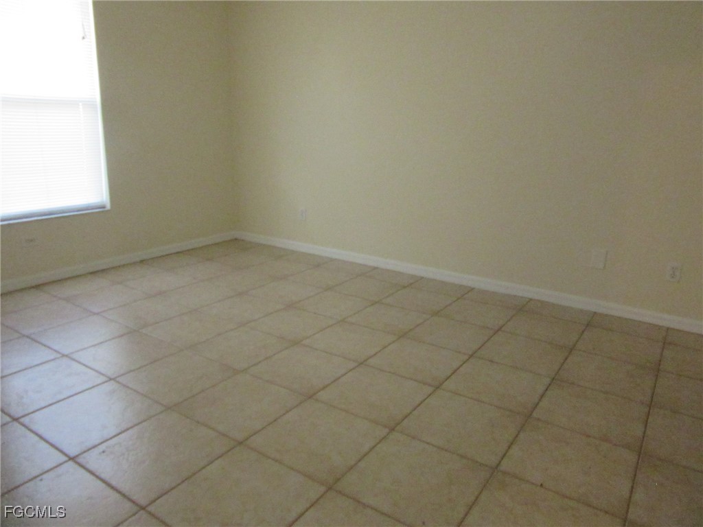 4544-4546 28th Street Southwest Lehigh Acres, FL 33973 - Photo 9 of 23 an empty room and a window