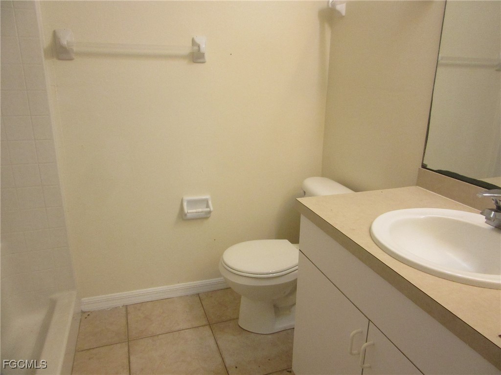 4544-4546 28th Street Southwest Lehigh Acres, FL 33973 - Photo 10 of 23 a bathroom with a sink and a toilet