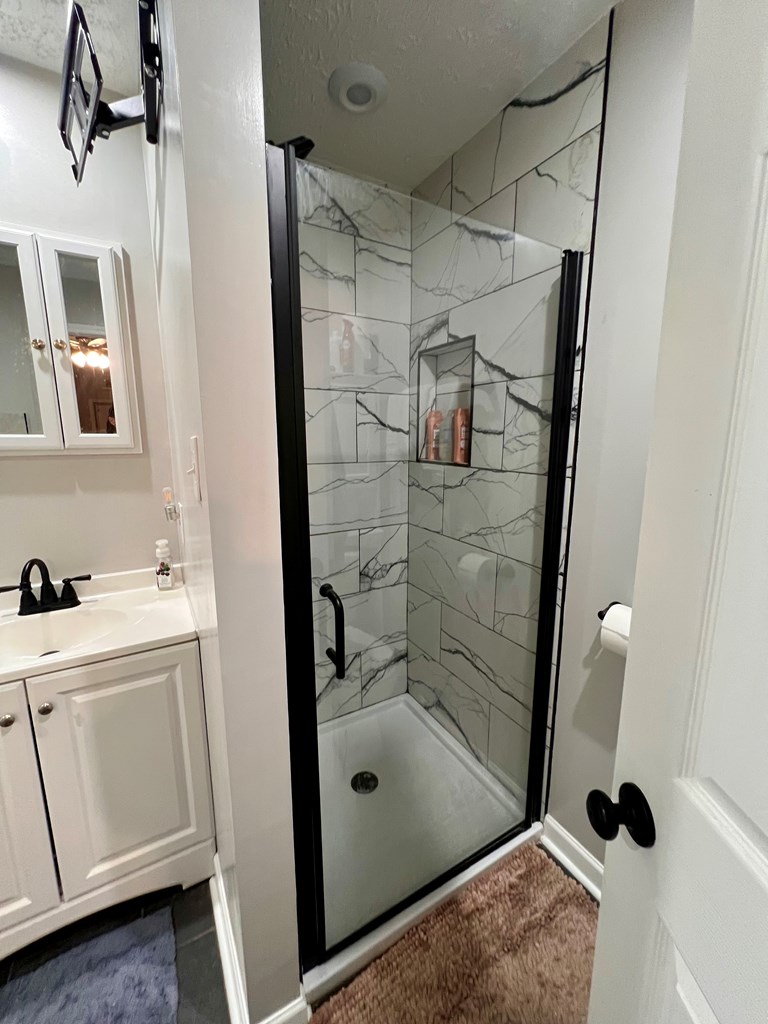 263 Nightingale Drive Columbus, GA 31906 - Photo 12 of 19 a bathroom with a sink and mirror