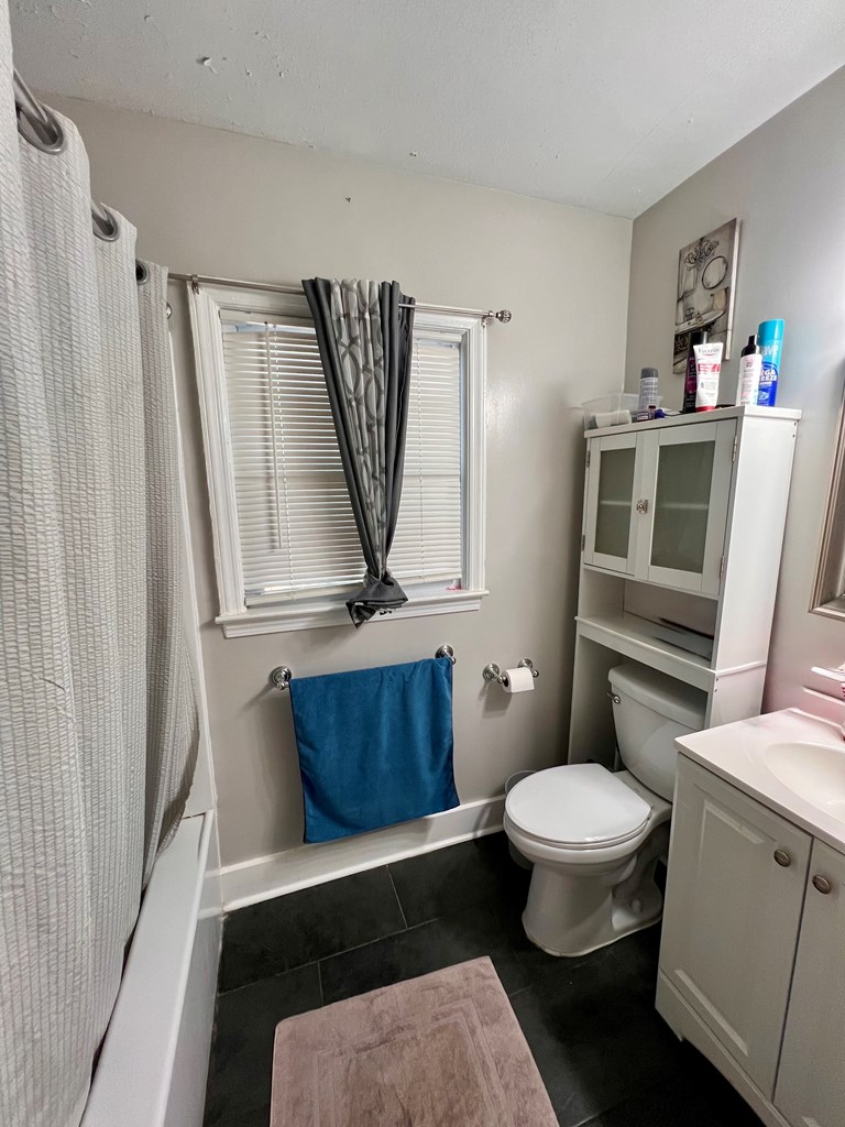 263 Nightingale Drive Columbus, GA 31906 - Photo 15 of 19 a bathroom with a toilet a sink and a mirror