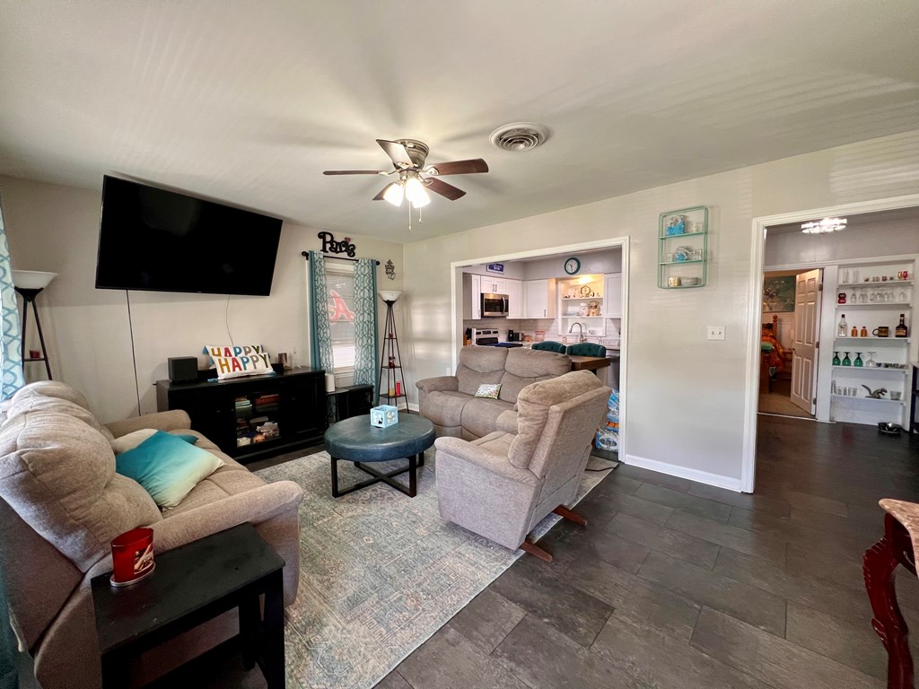 263 Nightingale Drive Columbus, GA 31906 - Photo 2 of 19 a living room with furniture and a flat screen tv