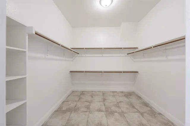 a view of an empty walk in closet