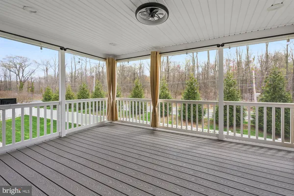 a view of an empty room and wooden floor