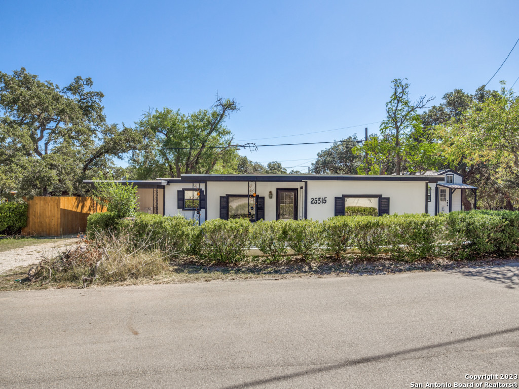25315 Triangle Loop San Antonio, TX 78255 - Photo 1 of 1 a front view of a house with a garden