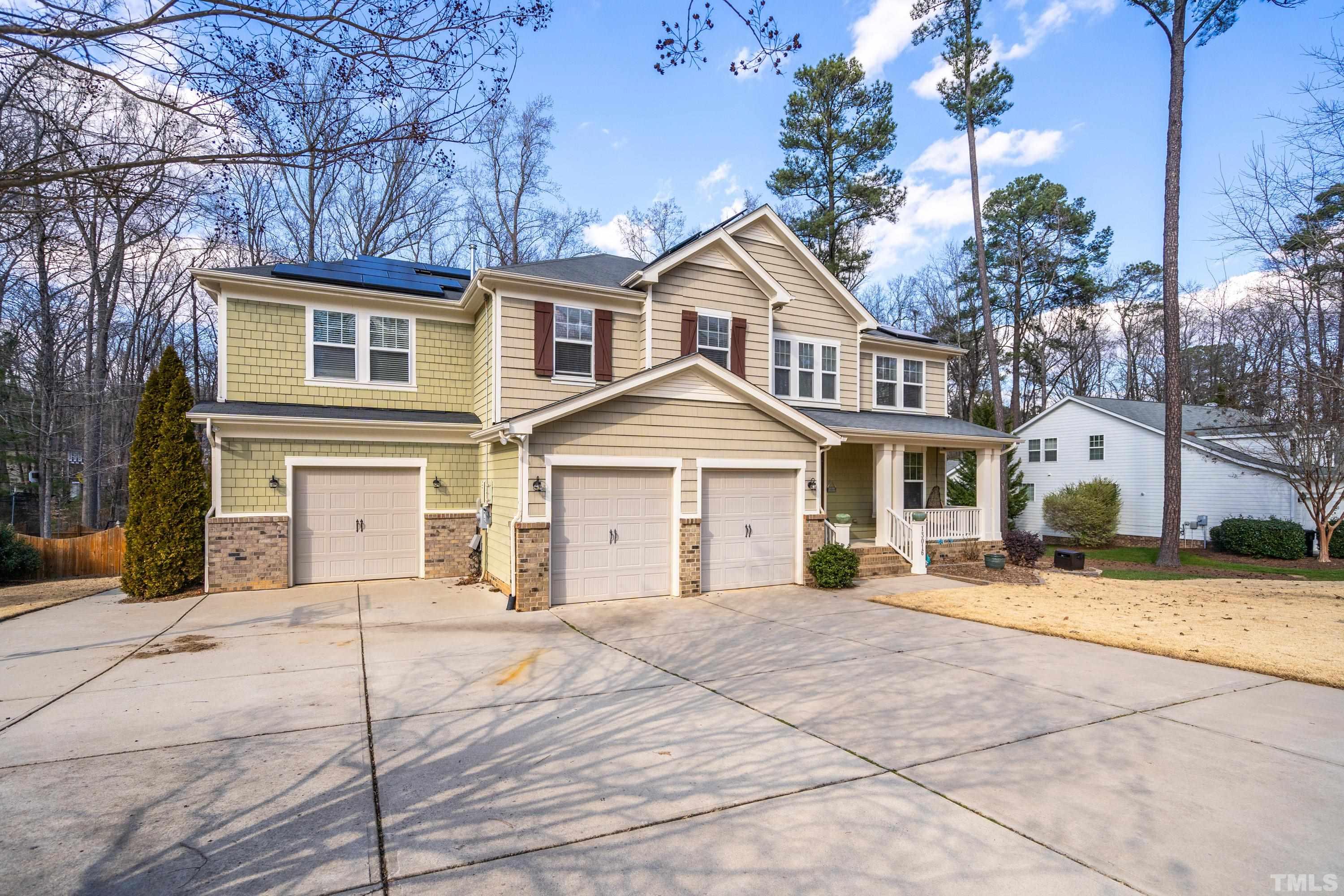 13016 Saxon Way Raleigh, NC 27613 - Photo 16 of 49 a front view of a house with a yard