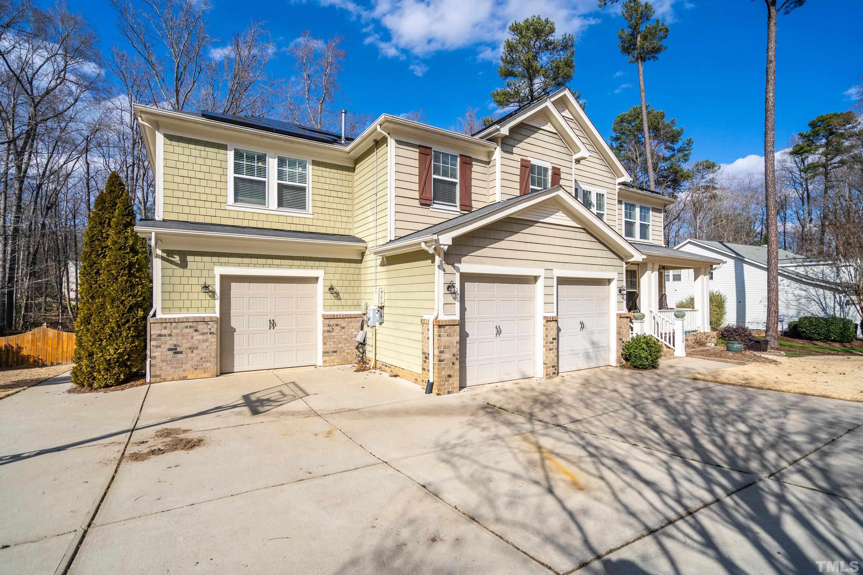 13016 Saxon Way Raleigh, NC 27613 - Photo 21 of 49 a front view of a house with a yard