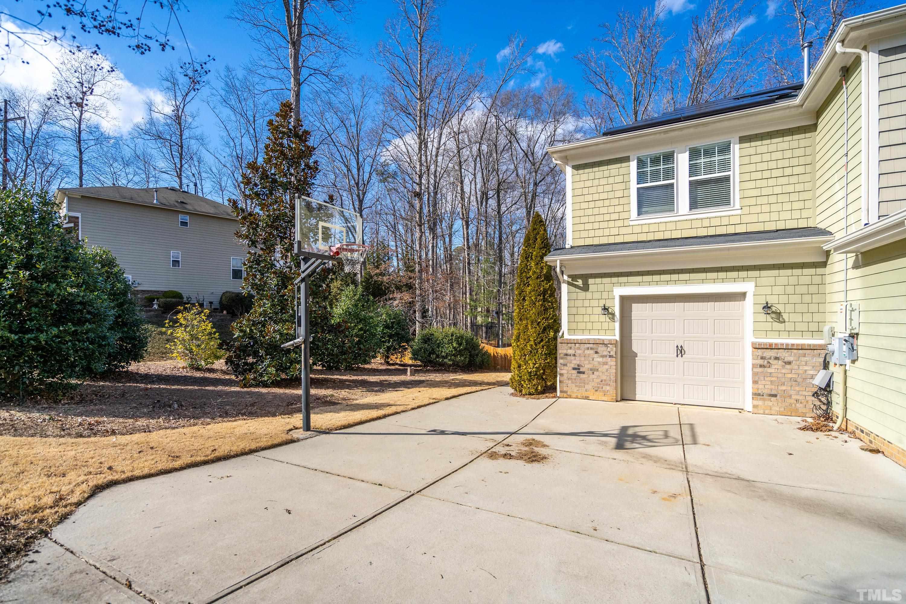 13016 Saxon Way Raleigh, NC 27613 - Photo 22 of 49 a front view of a house with a yard