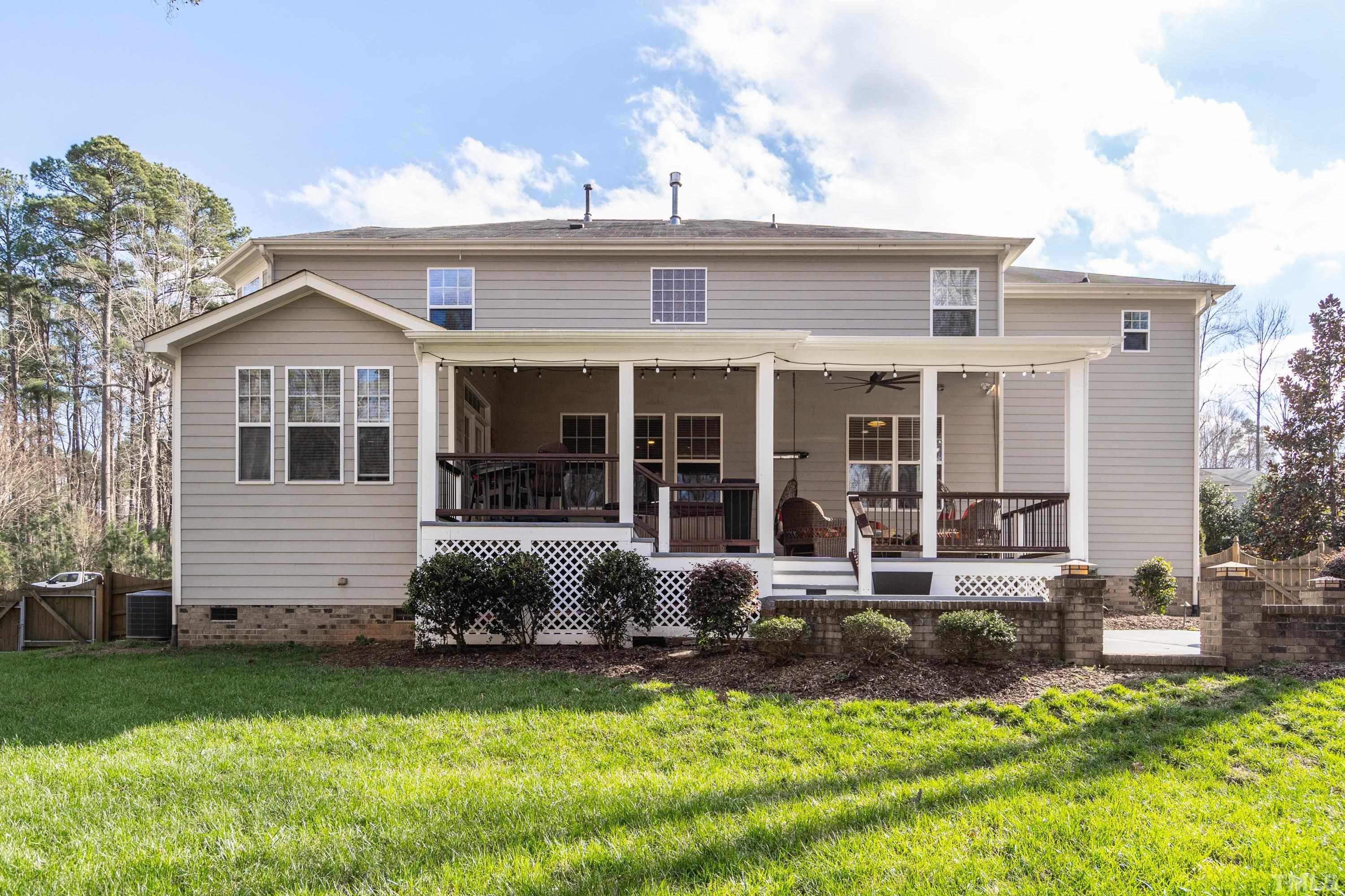13016 Saxon Way Raleigh, NC 27613 - Photo 26 of 49 a view of a house with a yard porch and sitting area