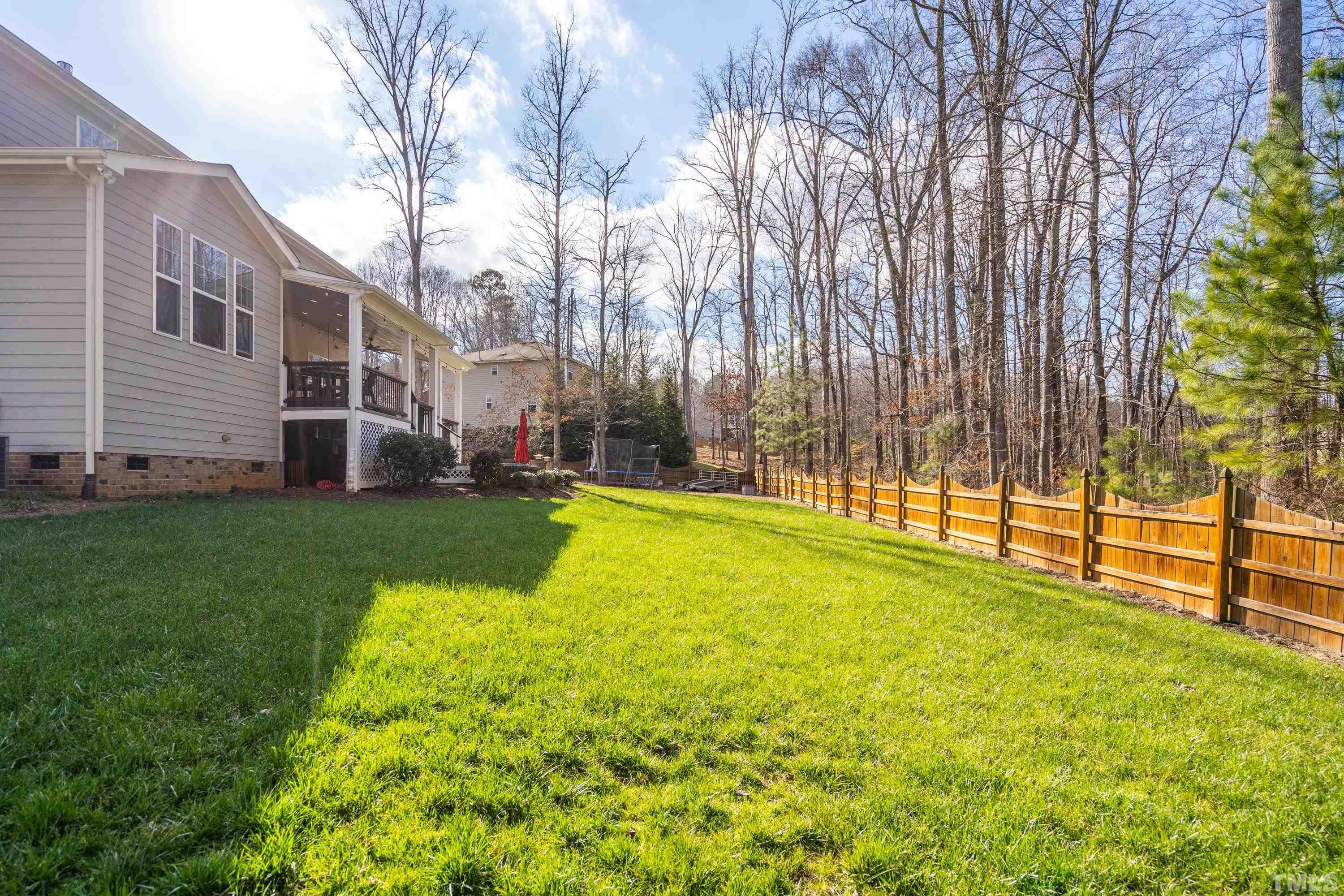 13016 Saxon Way Raleigh, NC 27613 - Photo 27 of 49 a view of yard with swimming pool and green space